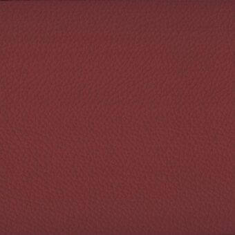Burgundy synthetic leather swatch displaying a textured, embossed grain pattern with fine lines and creases, offering a matte finish.